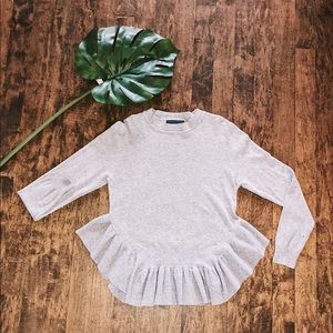 Grey sweater.